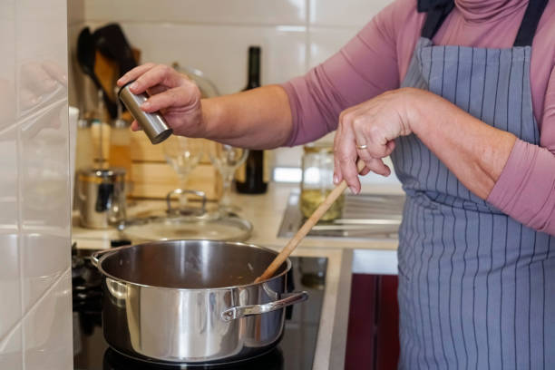 istock Senior woman cooking  at home 1127194650