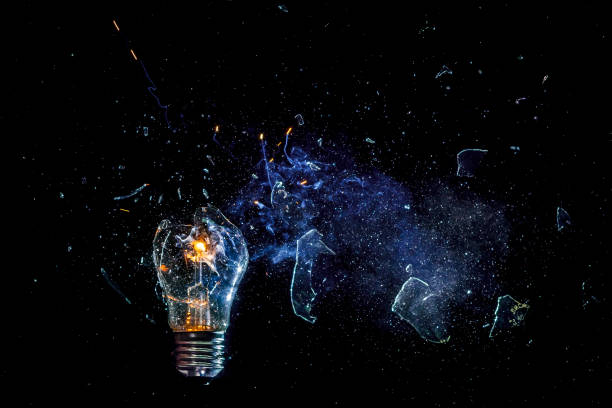 istock cosmic explosion of a burning light bulb with flying splinters and smoke on a black background with a flash 1127195741