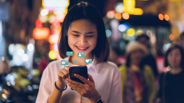 istock Woman hand using smartphone and show technology icon social media. Concept social network. 1127198642