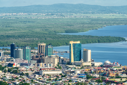 Downton area of Port of Spain in Trinidad and Tobago. Caroni sanctuary on the background behind the city center.