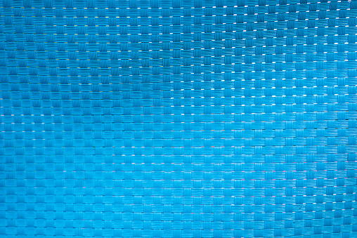 light blue plastic texture of a wicker wall. Horizontal frame