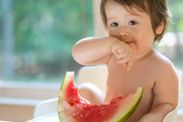 istock Toddler boy eating watermelon 1127202967