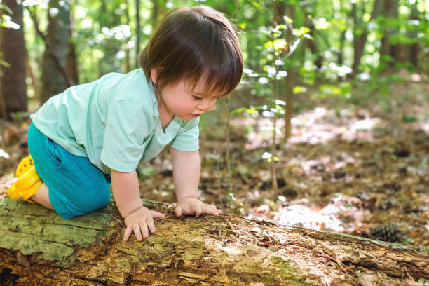 istock Toddler boy playing in the forest 1127203035