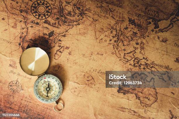 Navigator Explore Journey With Compass And World Map Travel Destination And Planning Vacation Trip Vintage Concept Stock Photo - Download Image Now