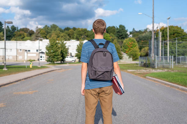 istock Teenager walking to school. 1127205375