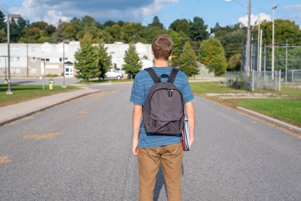 istock Teenager walking to school. 1127205377