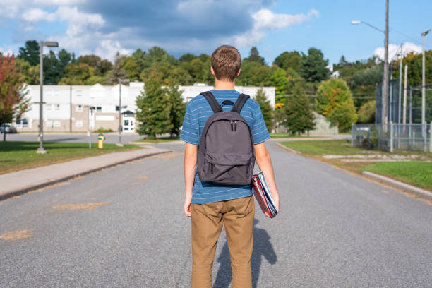 istock Teenager walking to school. 1127205378