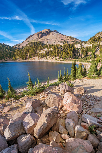 Stock photograph of Lake Helen and Lassen Peak in Lassen Volcanic National Park on a sunny day.