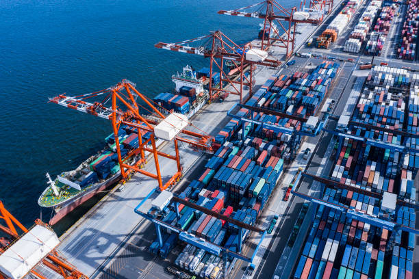 istock A large cargo ship loaded with many containers is fixed in the container area. 1127206942