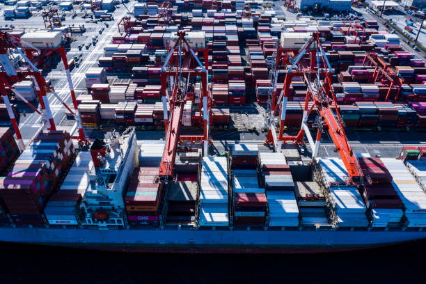 istock A large cargo ship loaded with many containers is fixed in the container area. 1127206958