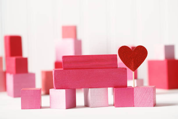 istock Pink and red blocks with hearts 1127208527