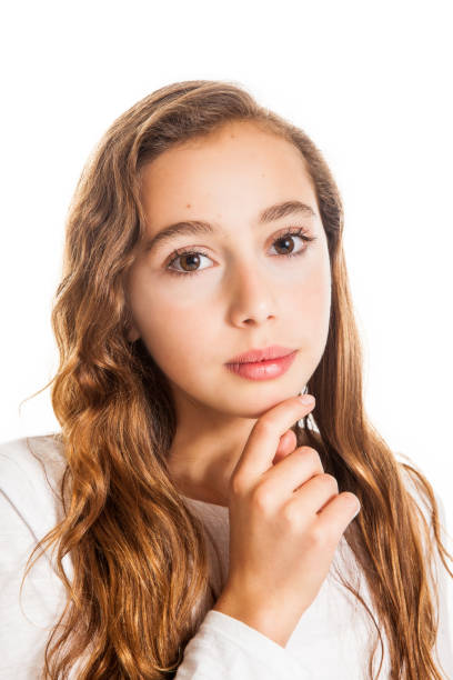 istock Beautiful young girl thinking or having an idea isolated on white background 1127208550