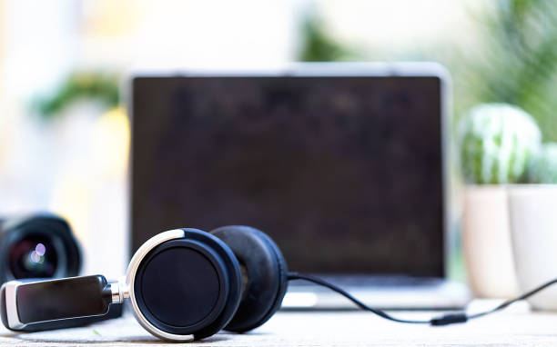 istock headphones with laptop computer on a bright background 1127209949