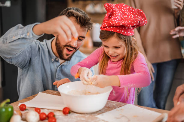 istock Preparing food together 1127211394