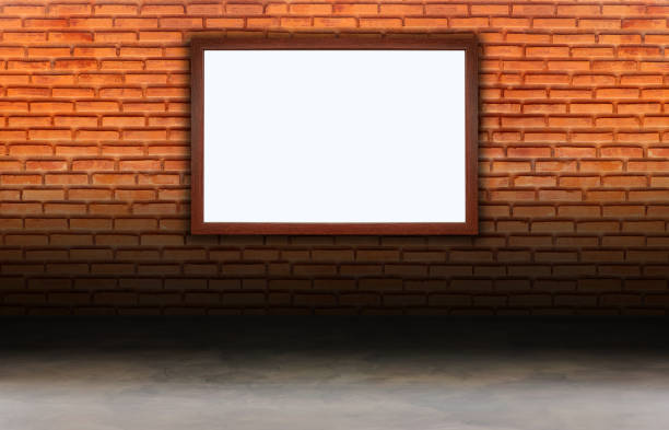 istock White billboard or advertise with oak frame on red brick wall with concrete floor 1127213868