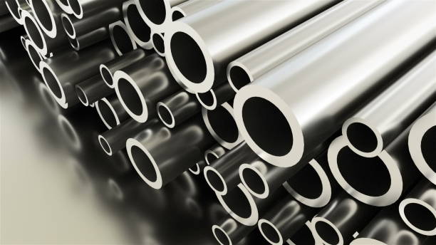 istock Rolled round metal industrial shiny tubes background, 3d render of metallic objects, shaped tubes 1127223289