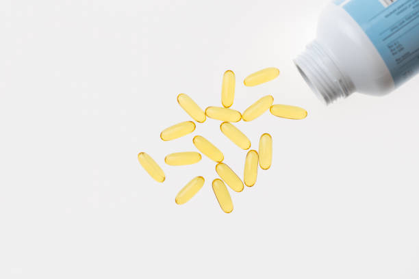 istock The cod liver oil capsules isolated on white background. Cod liver oil is a dietary supplement derived from liver of cod fish (Gadidae). 1127225103
