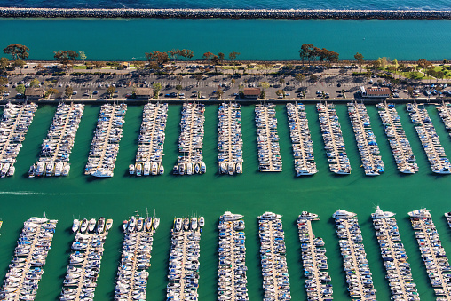 A detail view of yachts moored at the docks of the Dana Point Marina located in Dana Point, California, in Orange County.