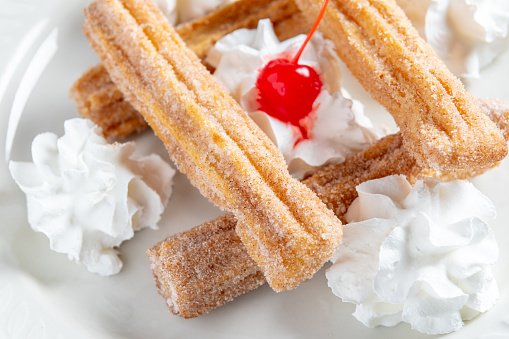 Churros with whipped cream