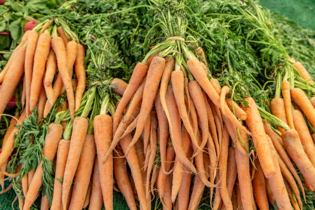 istock Carrots on a Farmers Market Stall 1127226601