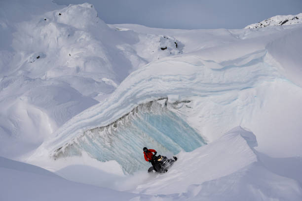 istock Snowmobiling fresh powder in the mountains 1127233647