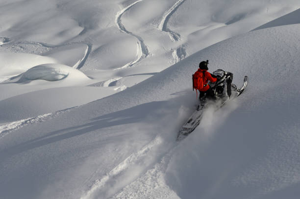 istock Snowmobiling fresh powder in the mountains 1127233649