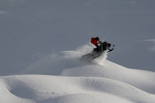 istock Snowmobiling fresh powder in the mountains 1127233650