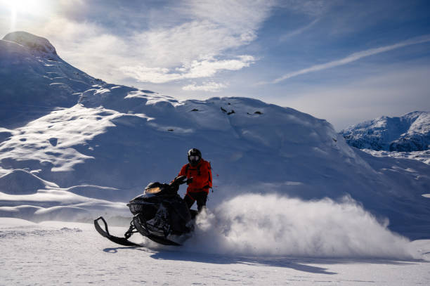 istock Snowmobiling fresh powder in the mountains 1127233651