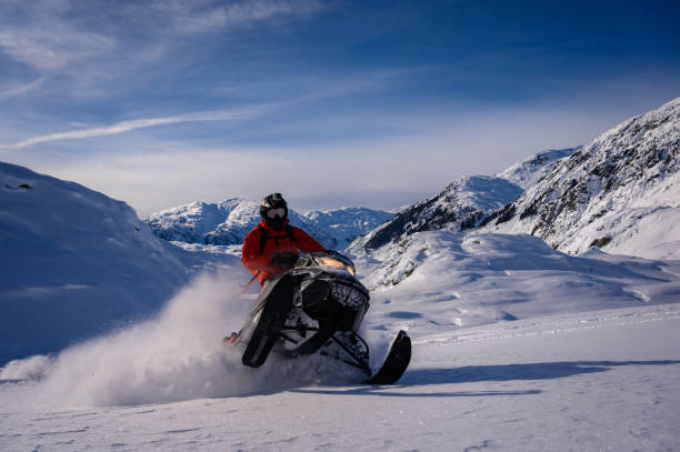 istock Snowmobiling fresh powder in the mountains 1127233659