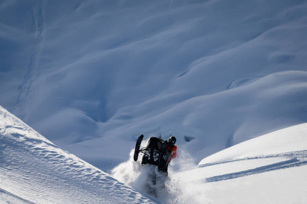 istock Snowmobiling fresh powder in the mountains 1127233663