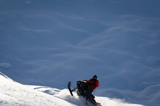 istock Snowmobiling fresh powder in the mountains 1127233676