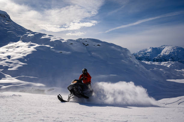 istock Snowmobiling fresh powder in the mountains 1127233681