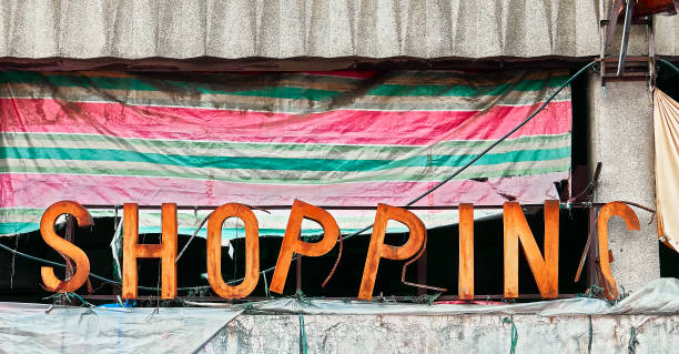 Rusty shopping entrance signboard Old rusty letter-style falling apart signboard outside a shopping complex in Divisoria market, Manila, Philippines divisoria market stock pictures, royalty-free photos & images