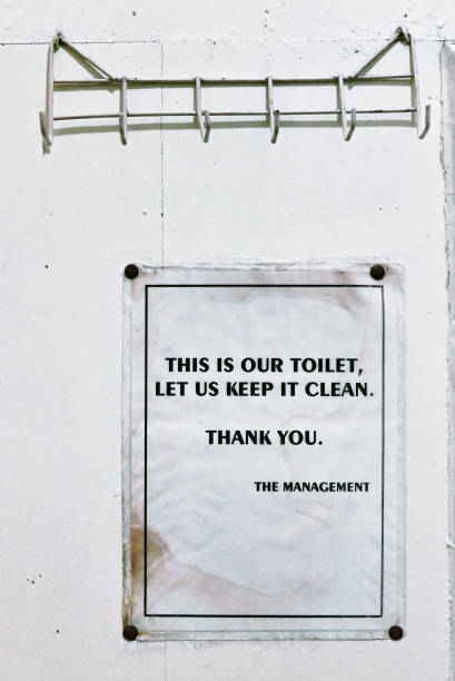 istock Toilet advisory sign hanging at a wall 1127237076