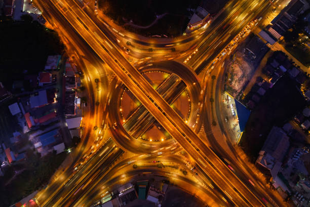 istock Aerial view of highway junctions with roundabout. Bridge roads shape circle in structure of architecture and transportation concept. Top view. Urban city, Bangkok at night, Thailand. 1127238964