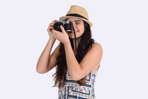 istock Young woman in summer hat with vintage camera. 1127239813