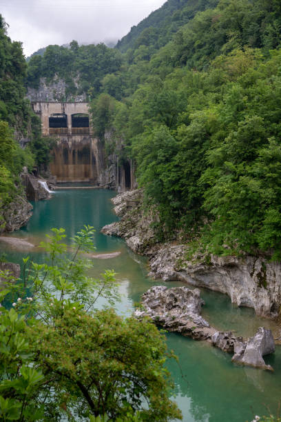 istock Huge power plant dam in the river canyon 1127239862