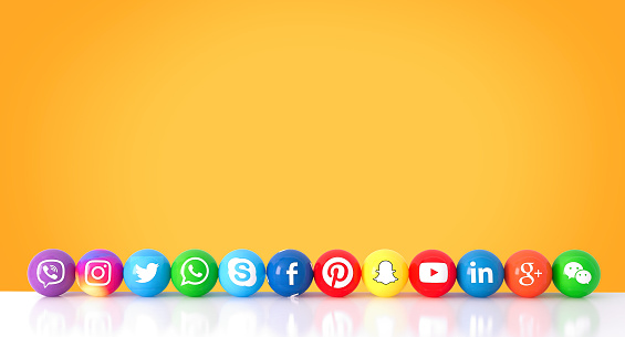 Istanbul, Turkey - November 05, 2018 : Sphere shape of popular social media services icons, including Facebook, Instagram, Youtube, Twitter, Whatsapp, Linkedin, Snapchat, Pinterest, Viber, Google, Wechat, Skype on an orange desk