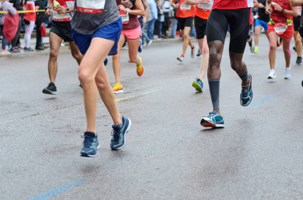 istock Marathon running race, many runners feet on road 1127242278