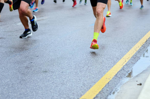 istock Marathon running race, many runners feet on road 1127242279