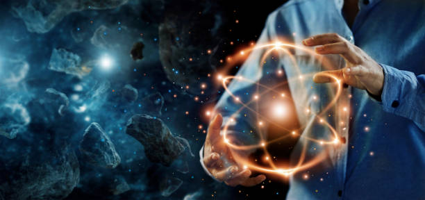 Abstract science, hands holding atomic particle, nuclear energy imagery and network connection on meteorites space planets background. Abstract science, hands holding atomic particle, nuclear energy imagery and network connection on meteorites space planets background. electron photos stock pictures, royalty-free photos & images