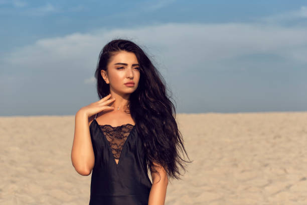 istock Beautiful brunette with long black curly hair 1127245444