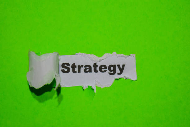 Strategy, business concept on green torn paper