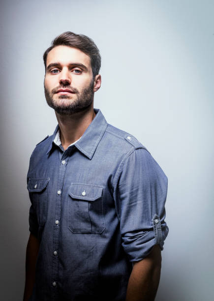 handsome happy young man in blouse on white background