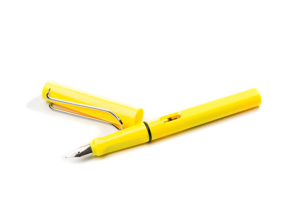 istock yellow modern fountain pen isolated on white, close up 1127246853
