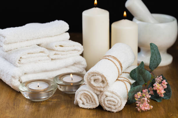 istock Spa still life with aromatic candles, flower and towel. - Image 1127247245