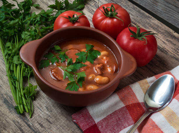 istock Bean soup in a brown bowl on a wooden table 1127247873