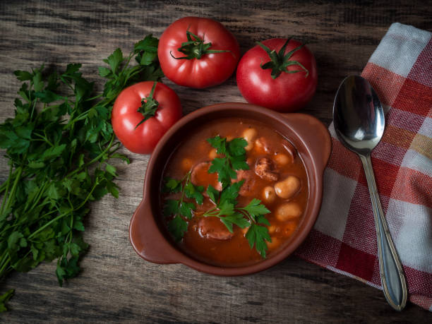 istock Bean soup in a brown bowl on a wooden table 1127247890