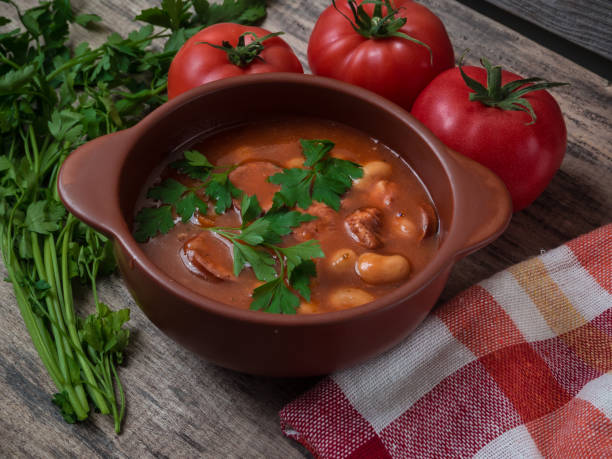 istock Bean soup in a brown bowl on a wooden table 1127247958