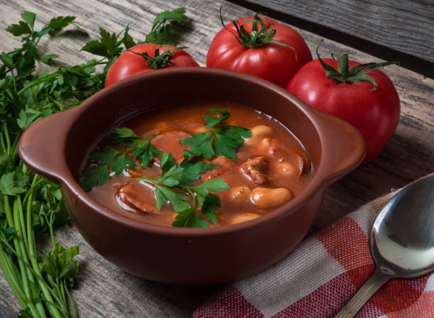 istock Bean soup in a brown bowl on a wooden table 1127247963
